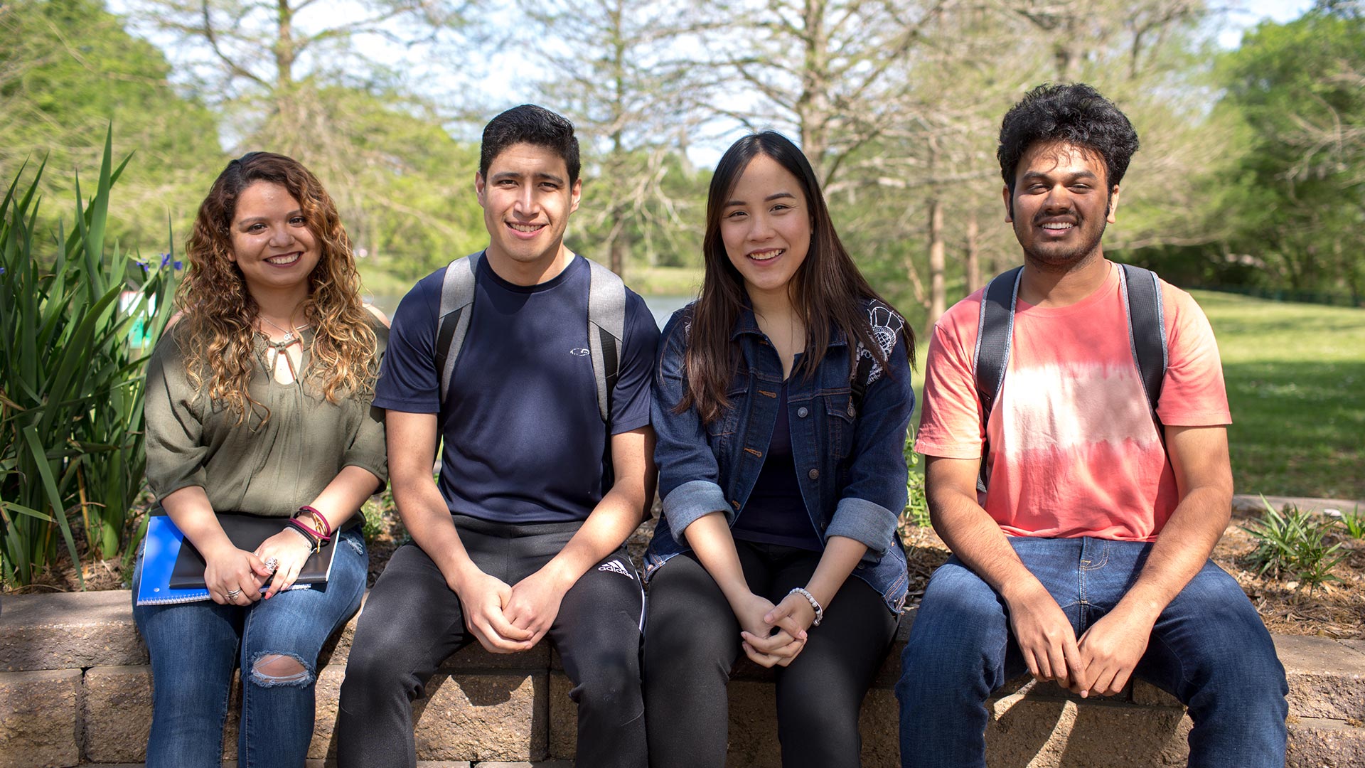 Photo of UHCL students sitting outside