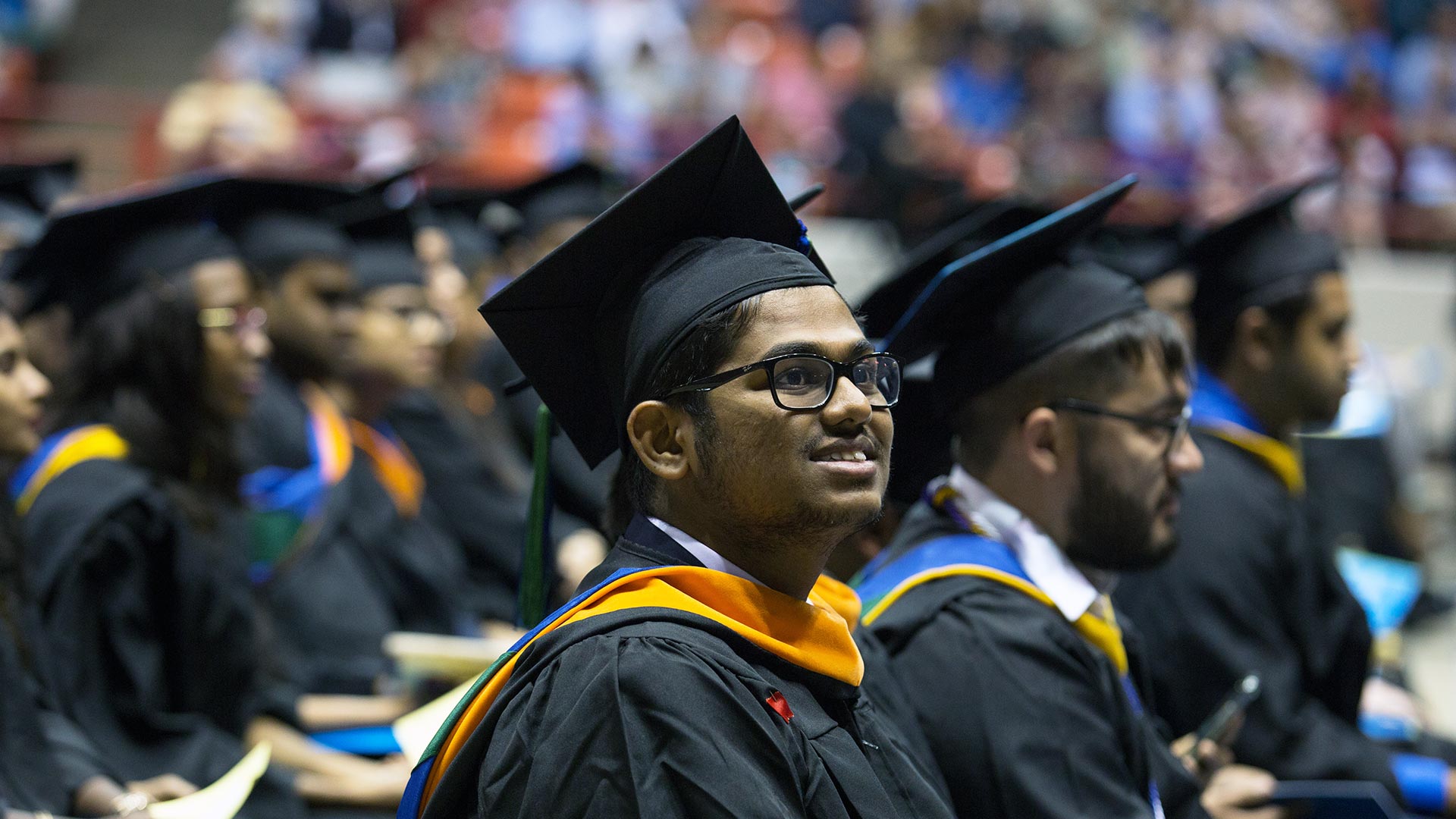 Photo of UHCL graduate at commencement