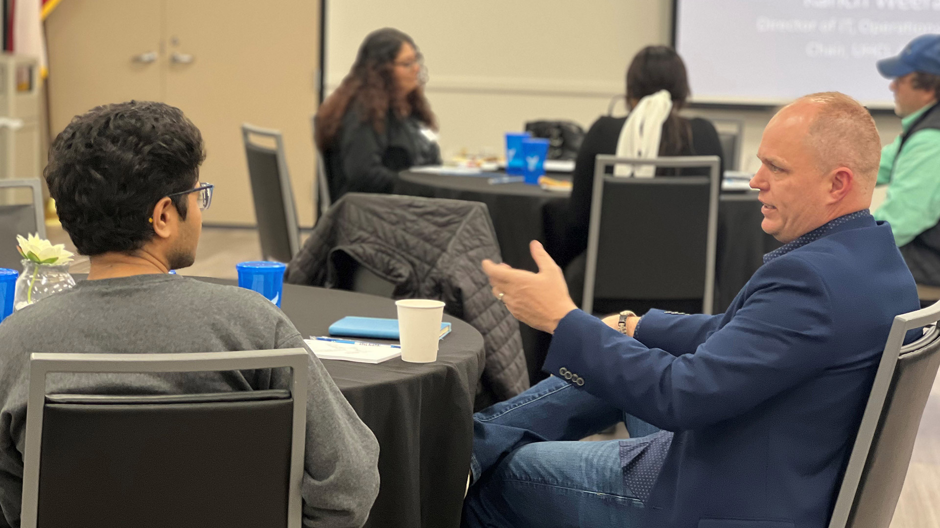 Photo of Hawk Mentorship Program participants at a table