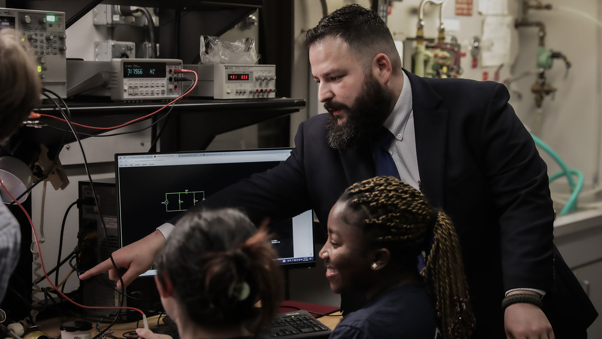 Teacher and students in computer lab