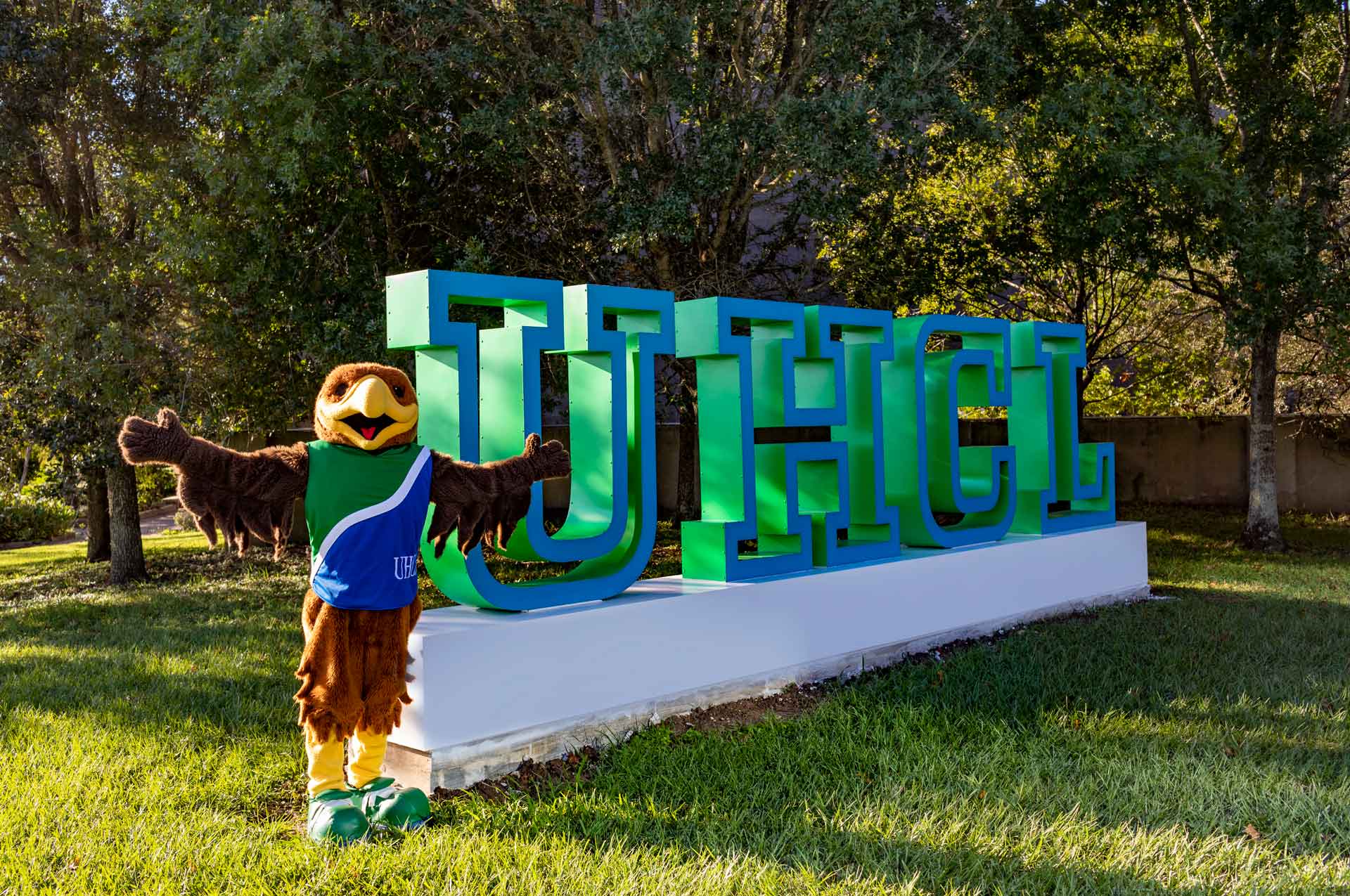 Hunter in front of the UHCL Letters